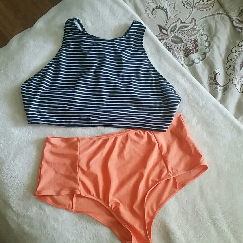 Black white orange high-waisted bathing suit.