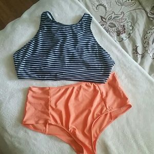 Black white orange high-waisted bathing suit.
