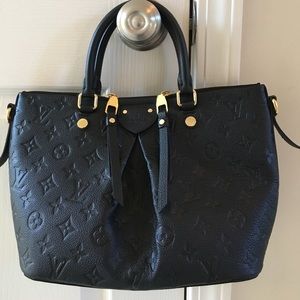 Authentic Louis Vuitton Mazarine noir.