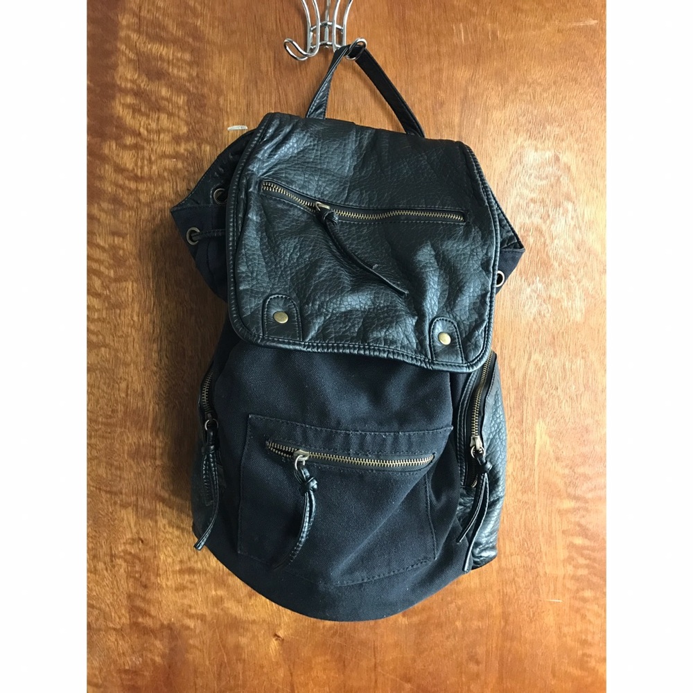 Black backpack with leather accents