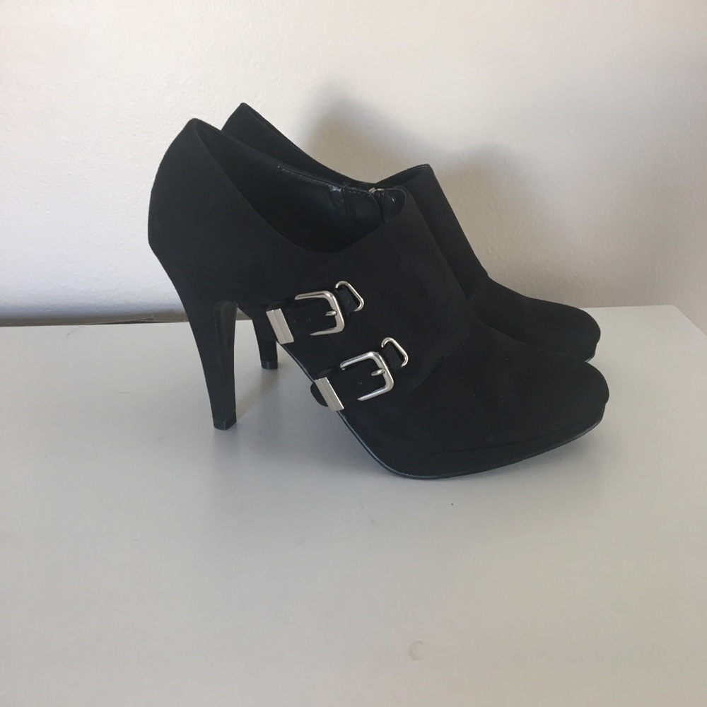 Black suede booties with silver buckles and zipper