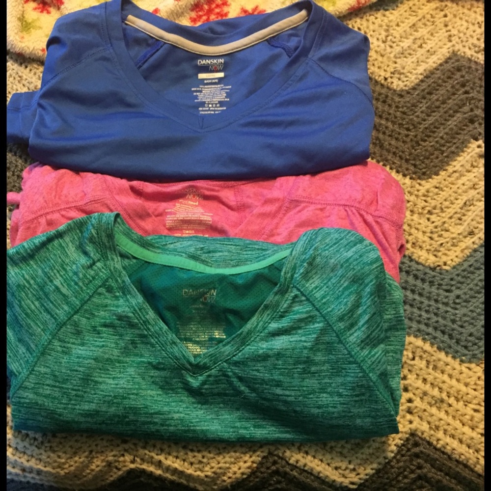 Three size small Daskin workout tees.