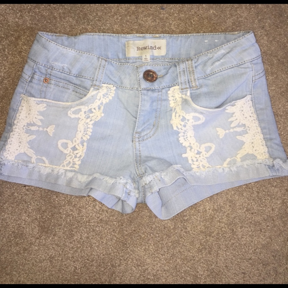 Light wash denim shorts with lace design!