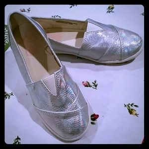 Little girls silver slip ons.