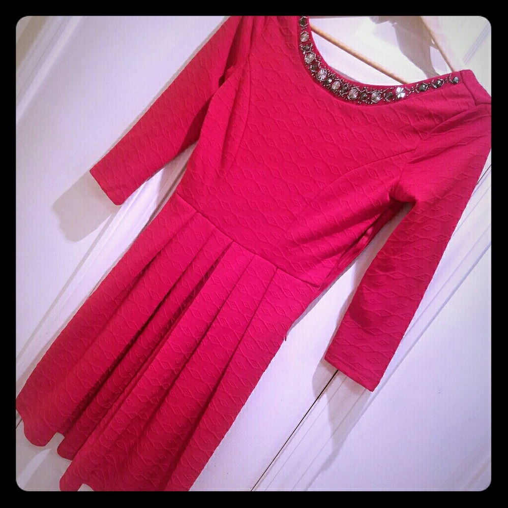 Red coctail dress with stitched on bow in back.