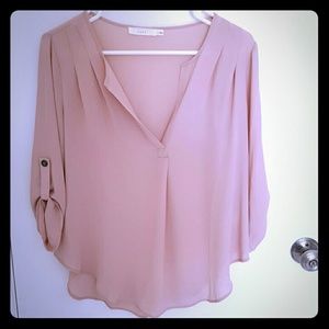 Lush pale pink blouse.