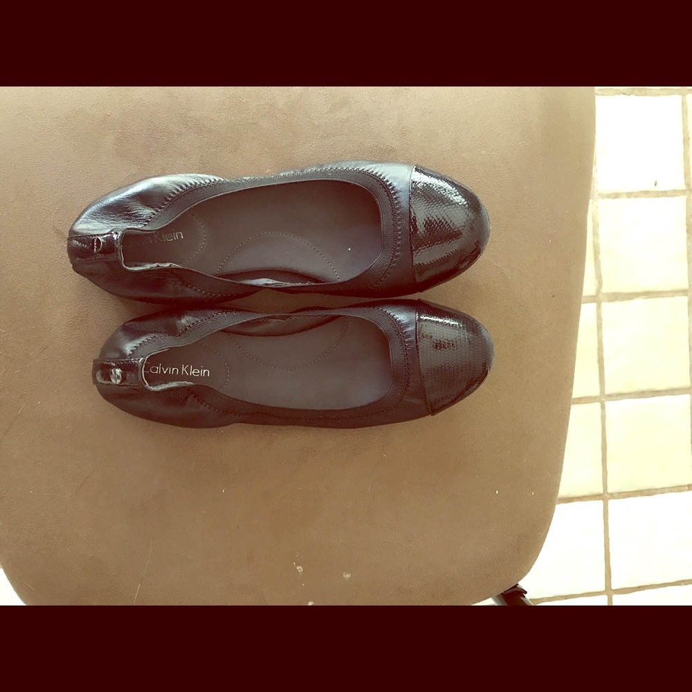 Calvin Klein black snakeskin hued flat