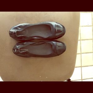 Calvin Klein black snakeskin hued flat