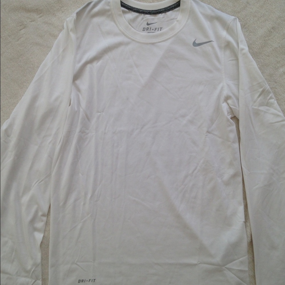 White long sleeve Nike dri fit shirt.