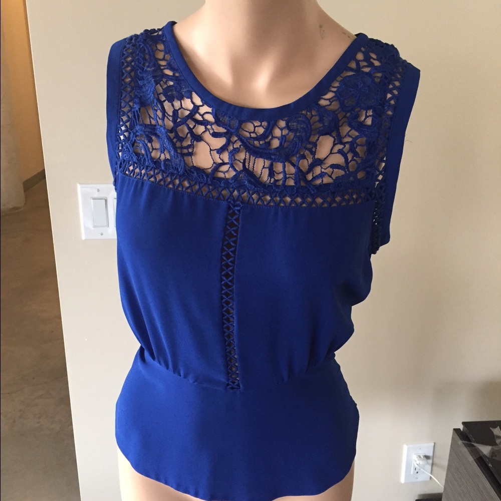 Blue blouse with crochet details.