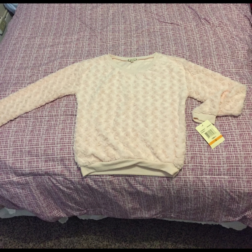 Soft pink sweater.