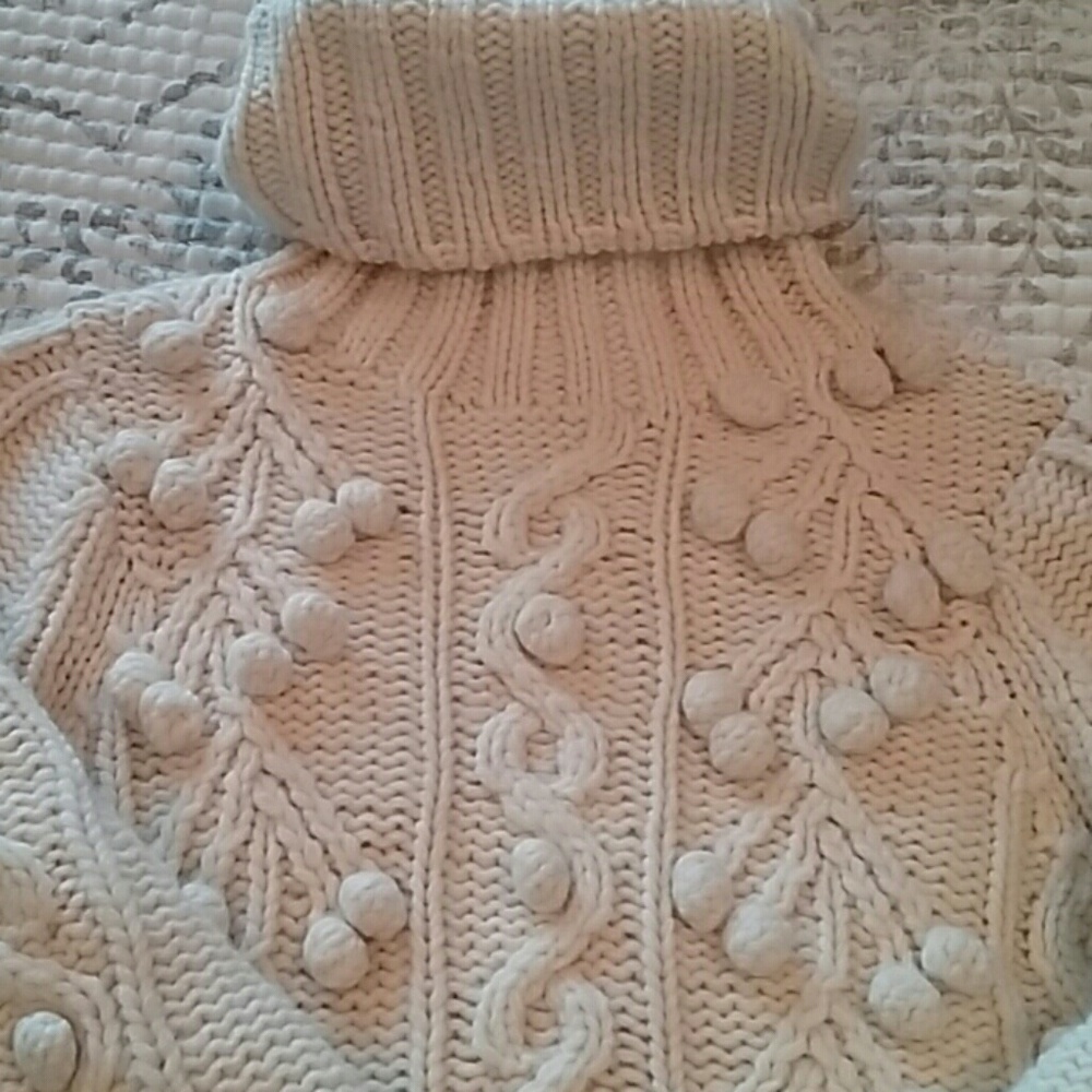 Amazing turtleneck wool pom pom sweater.