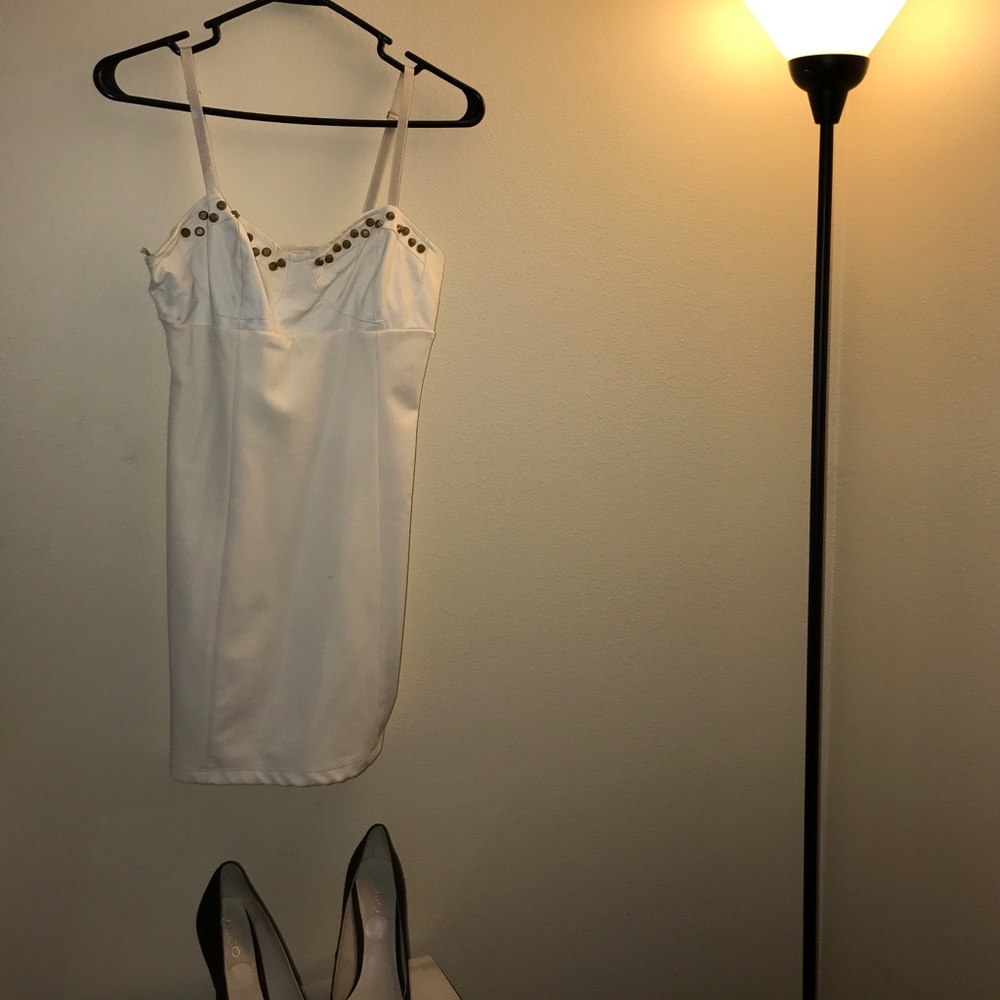 White dress w/ pleather detail. Gold studs.