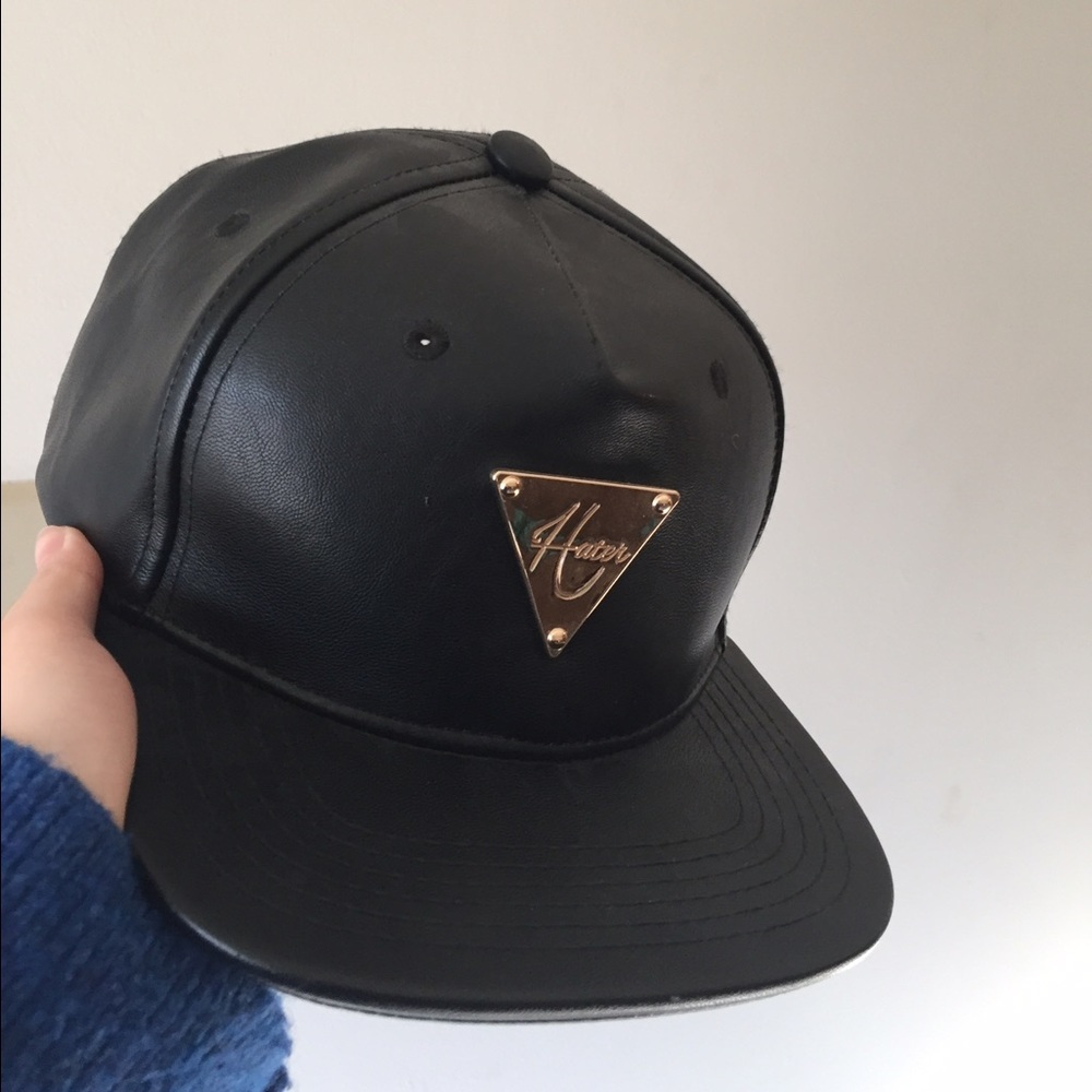 black leather hat with golden triangle