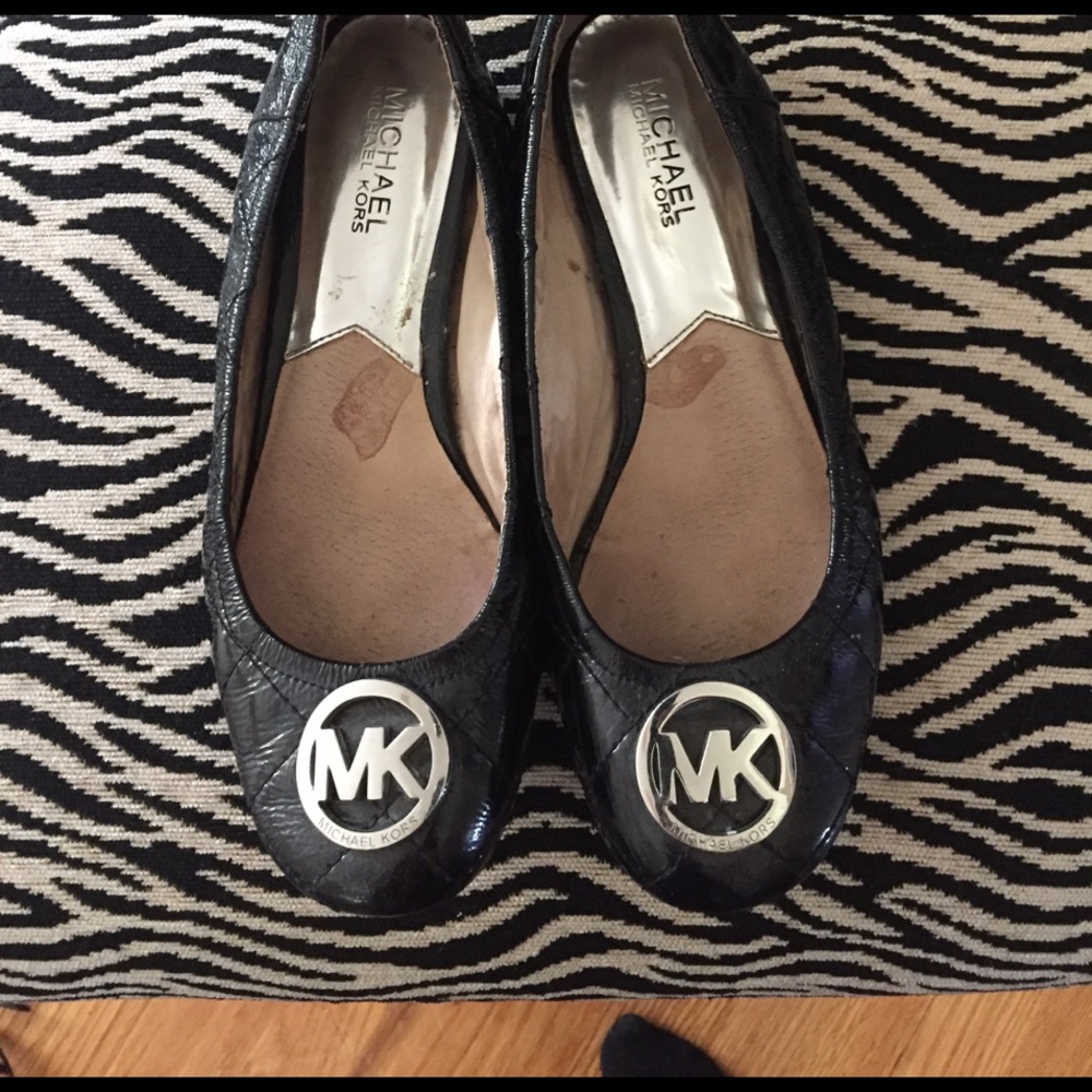 MK black leather flats. Used