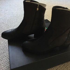 Black and brown leather ankle boots.