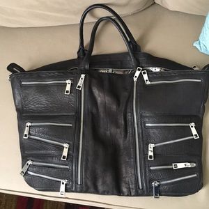 Black leather tote with silver zippers