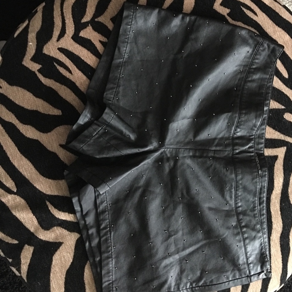 Black leather like shorts with gold studlets