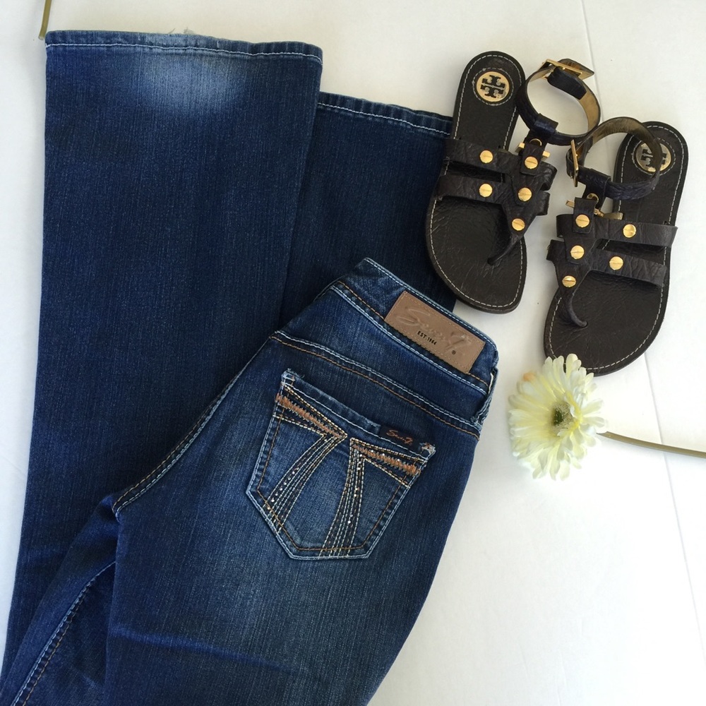 7 Flare leg jeans with embellishments.