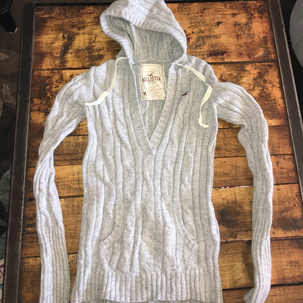Gray Hollister sweater with hood and front pockets