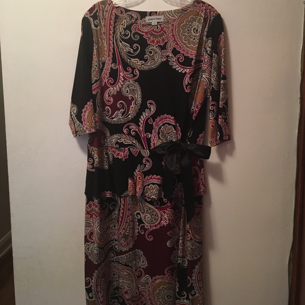 Multi colored dress with pemplum top.