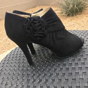 Black open toe booties with flower
