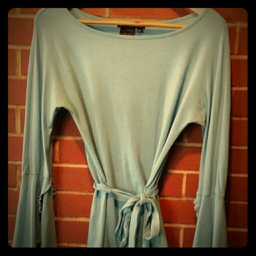 Light blue long sleeve top.