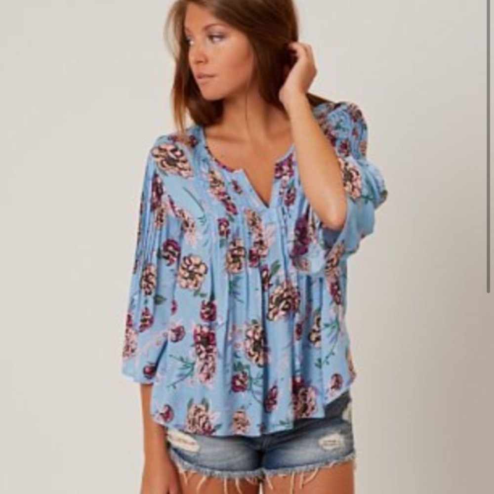 Blue floral patrons of peace top