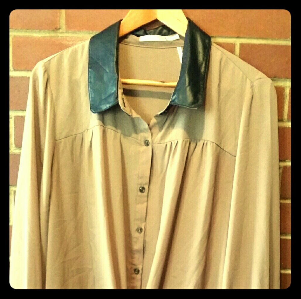 Tan silky button up with black shiny collar.