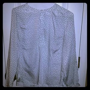 White blouse with little round black circle