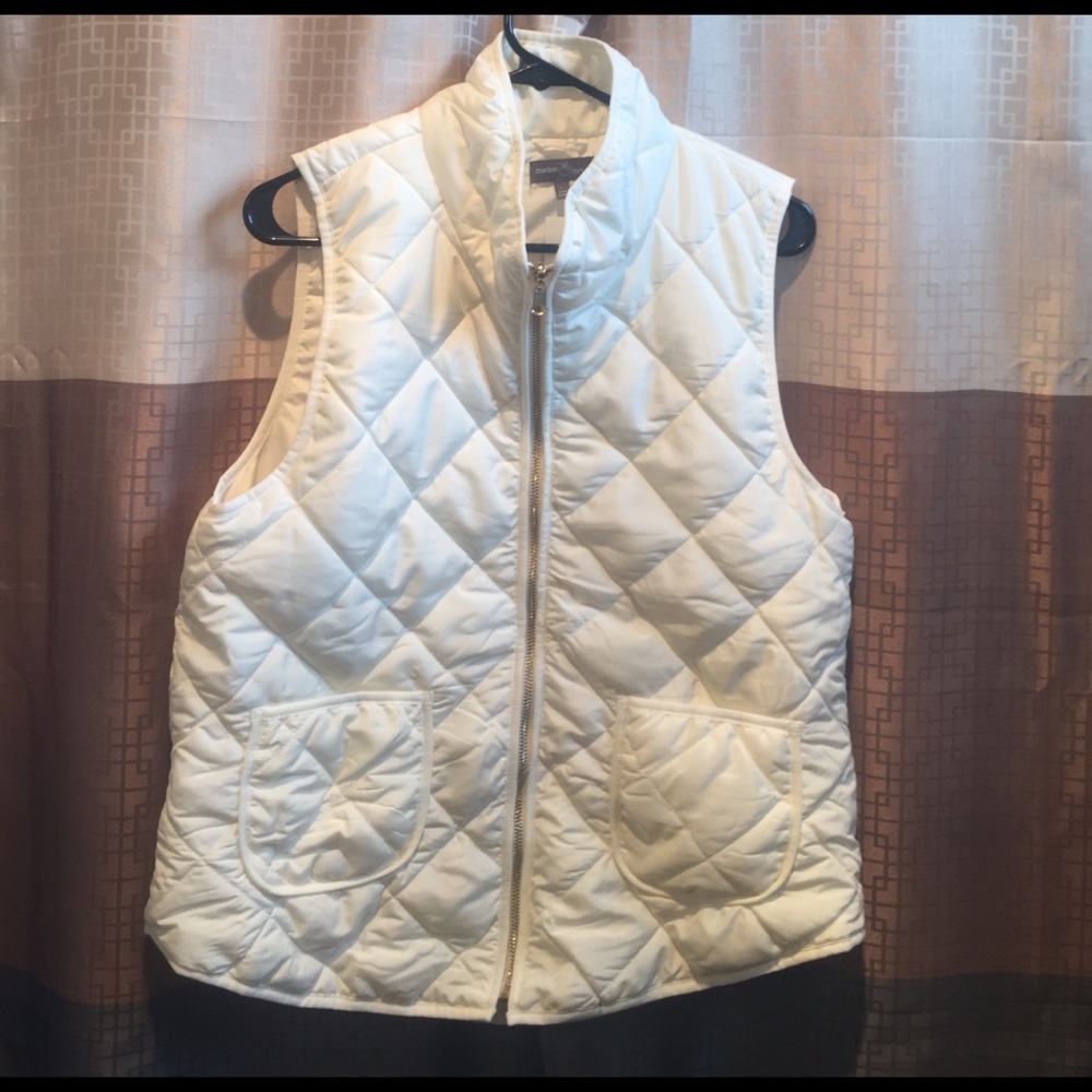 White puffer vest with gold details