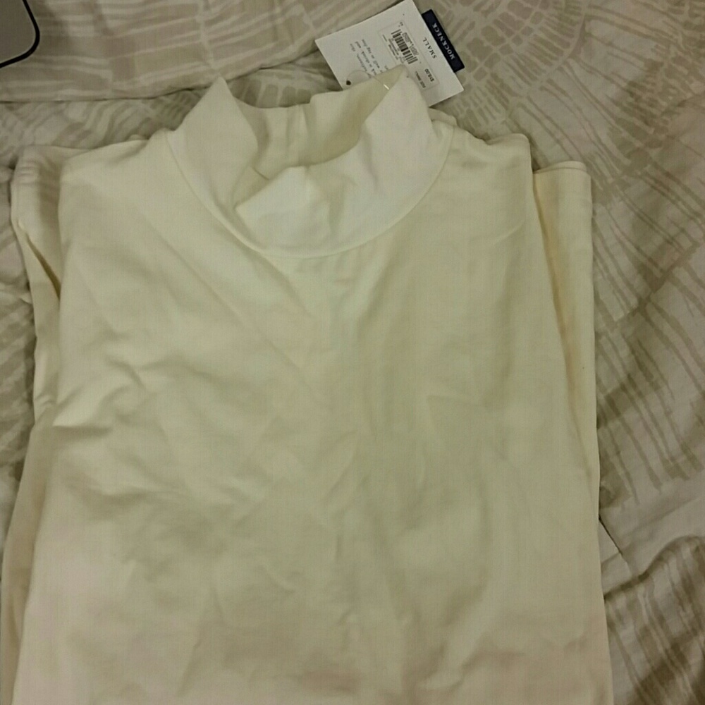 Cream turtleneck. Brand new with tags.