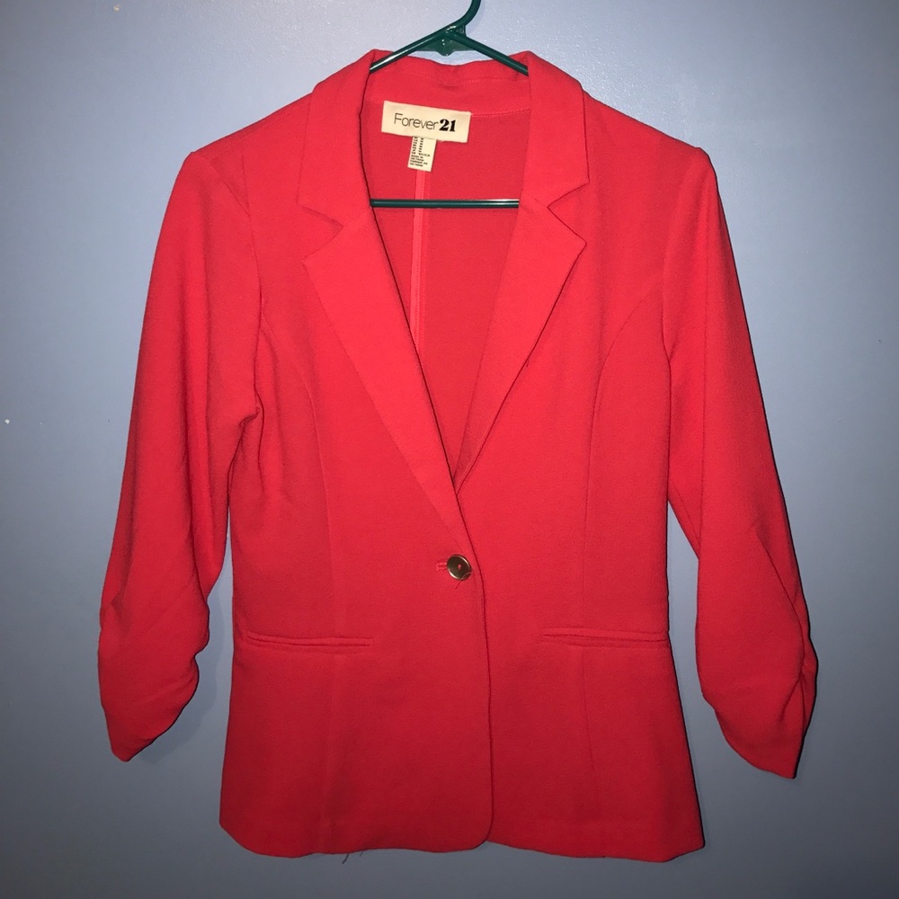 Pink blazer.