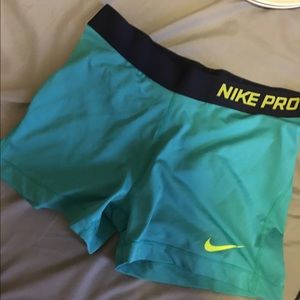 Blue and lime green Nike pros