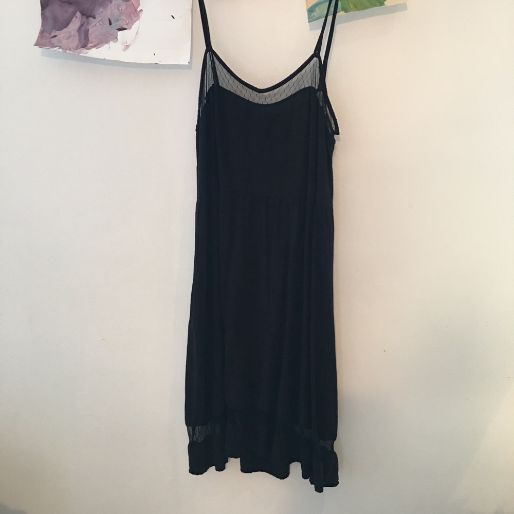 Black, slip-like dress.