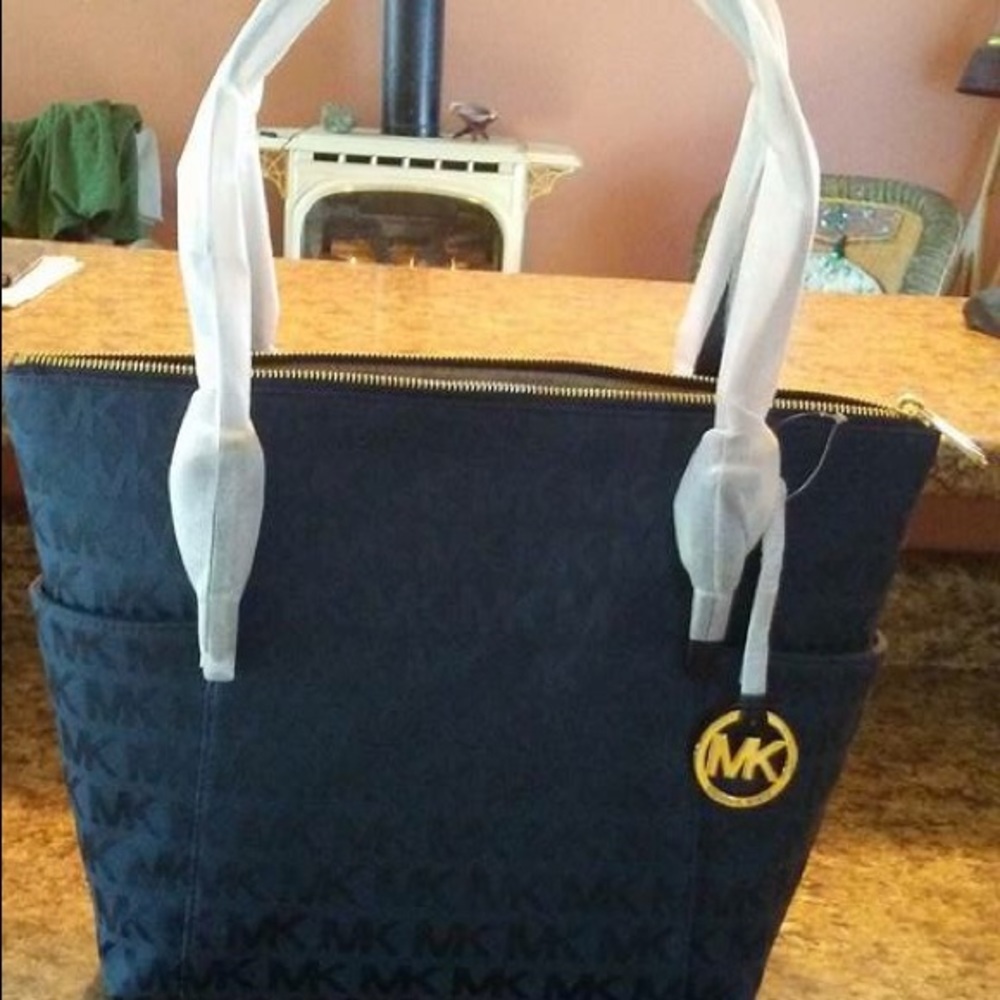 Brand new Michael Kors navy jet set