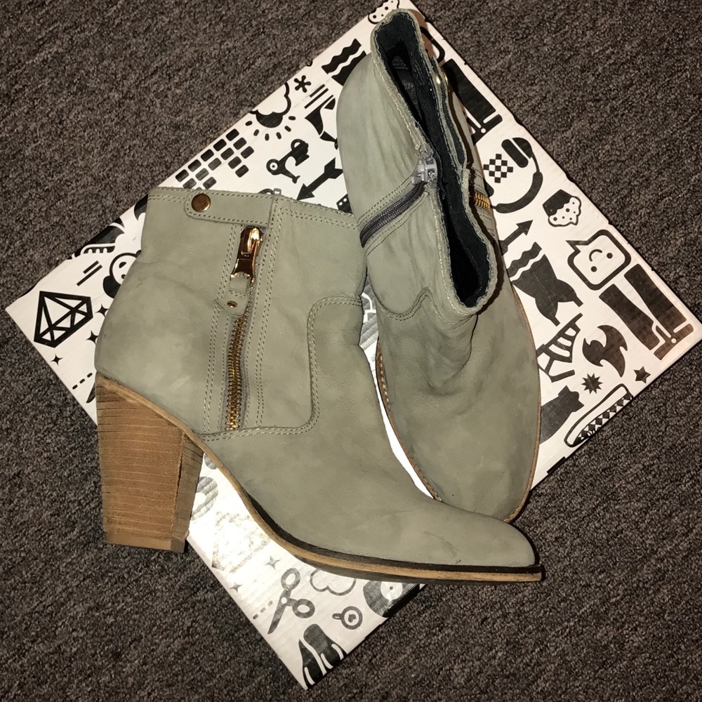 Grayish Aldo booties with a gold zipper