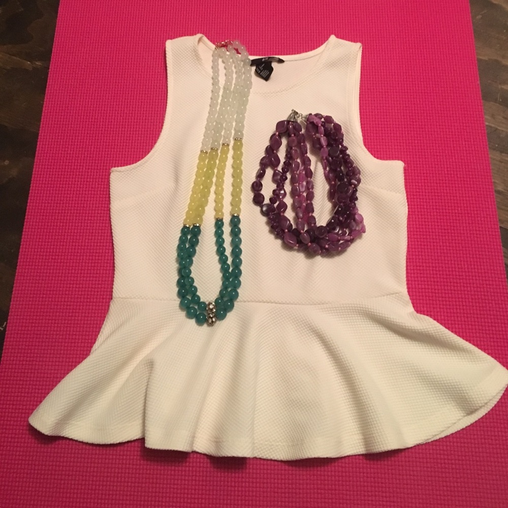 White peplum shirt with statement necklaces!