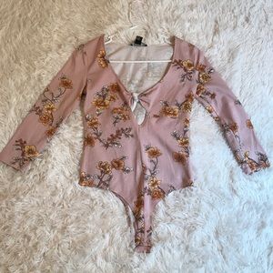 Pink floral body suit.