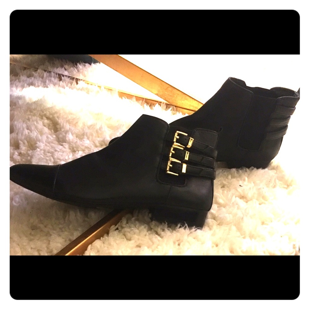 Chic ankle booties with gold detailing 👑