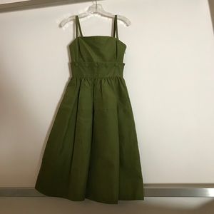 Green dress with detachable skirt and pockets