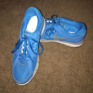 Bright blue Nike running shoes