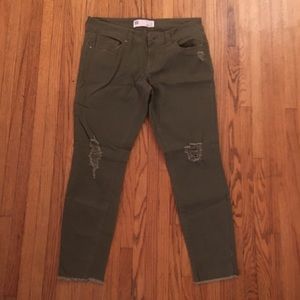 A pair of army green ankle cut jeans from Tillys