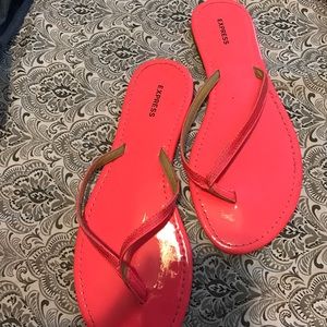 Neon pink flip flops