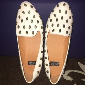 Gently used white skull flats