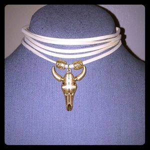 New creme suede lariat w/ gold tone cattle skull