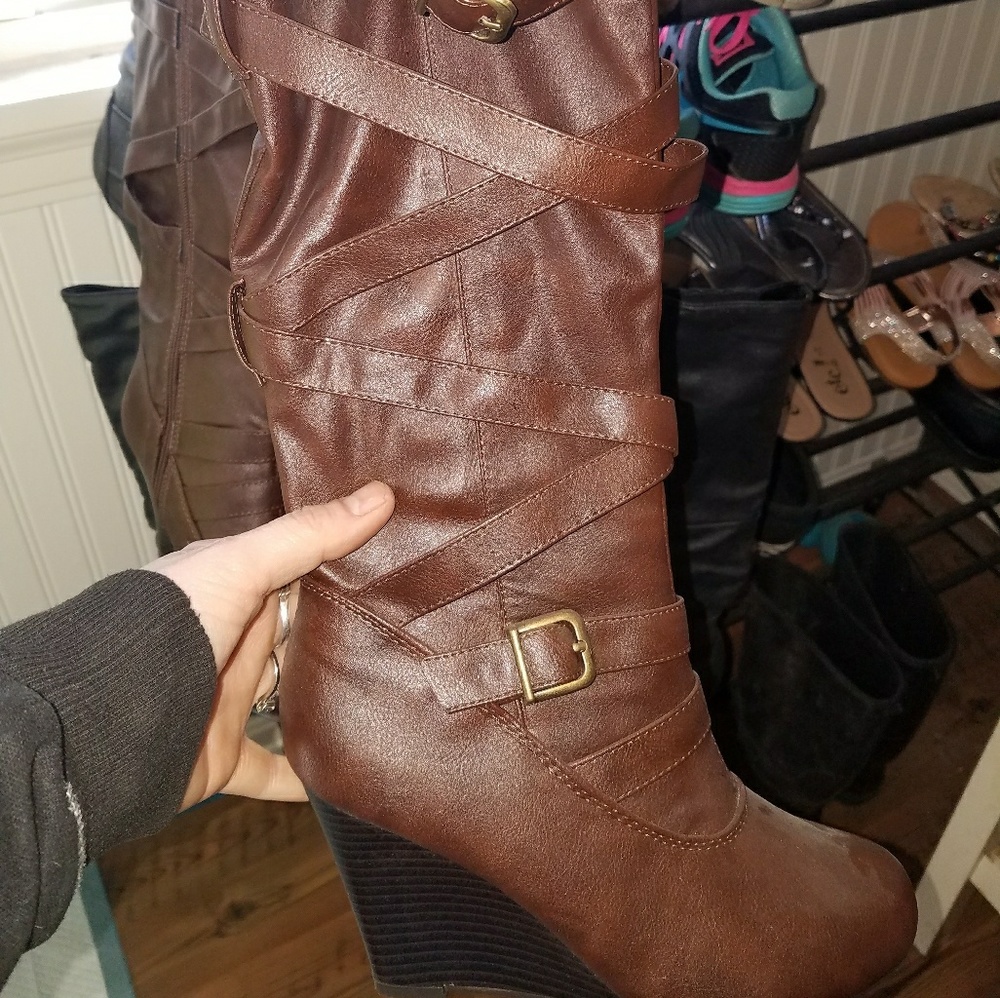 Pair of wedge knee high boots