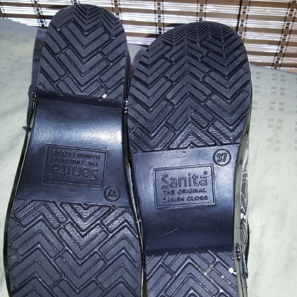 2 pairs sanita from dansko clogs.