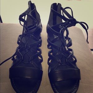 Black Franco Sarto strap up sandals.