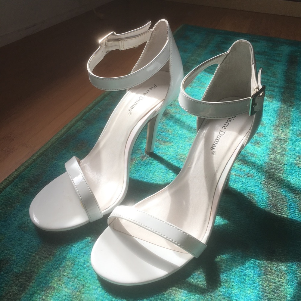 Sexy, strappy, ankle heels. Patent white material.